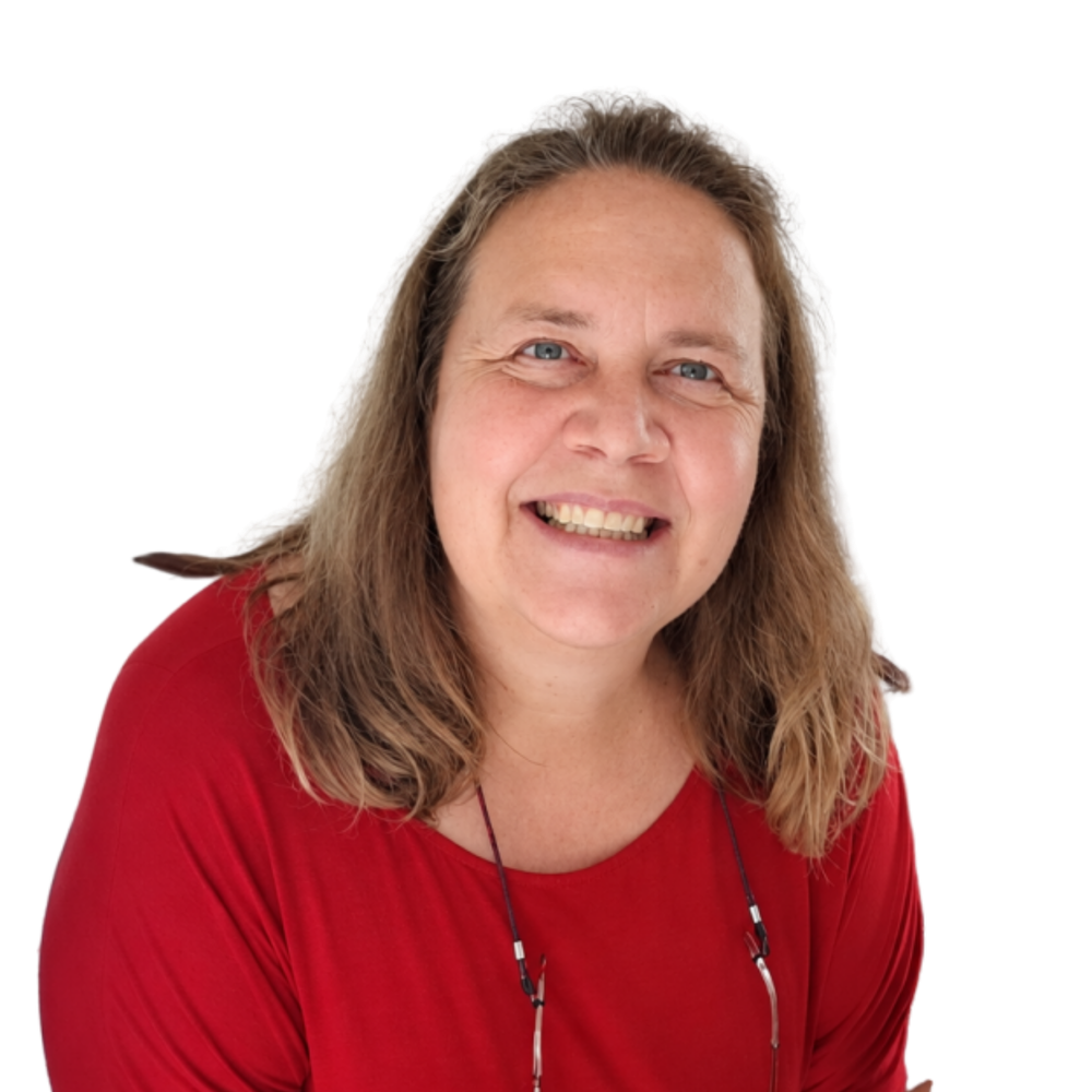 Dr Madri smiling in a red top